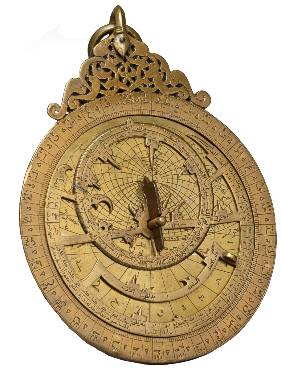 An ornate brass Islamic astrolabe, its rim and plates densely engraved in Arabic